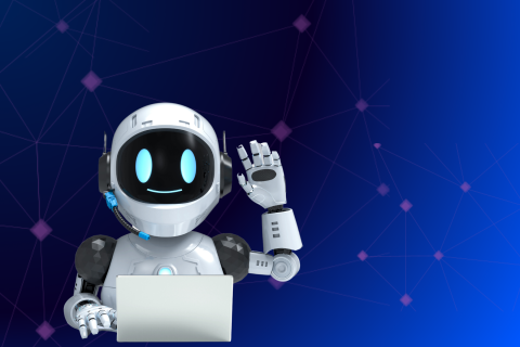 Ein kleiner Roboter vor einem Laptop der den Arm gehoben hat
